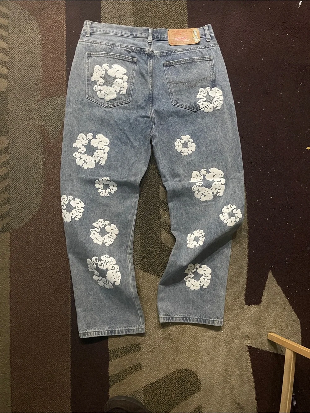 Relaxed Light Blue Jeans with White Graphic Clusters
